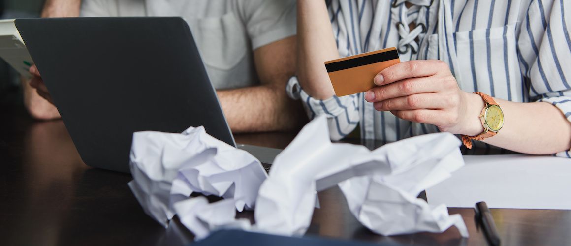 Woman evaluating her recent credit card bill.
