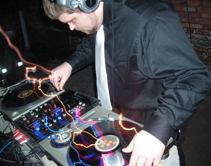 Image of Team Member Norm spinning records in a local club.