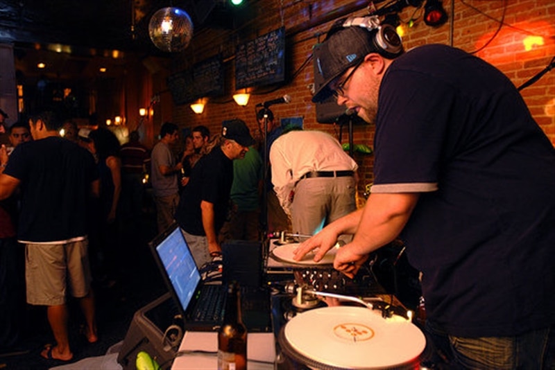 Image of Team Member Norm DJ-ing in downtown Detroit.