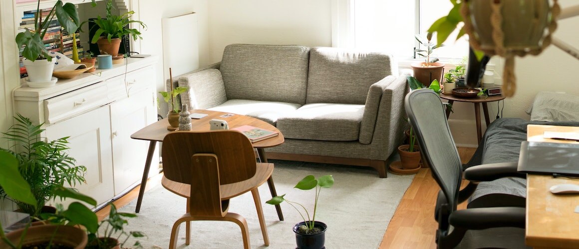 Image of apartment desk and living room.