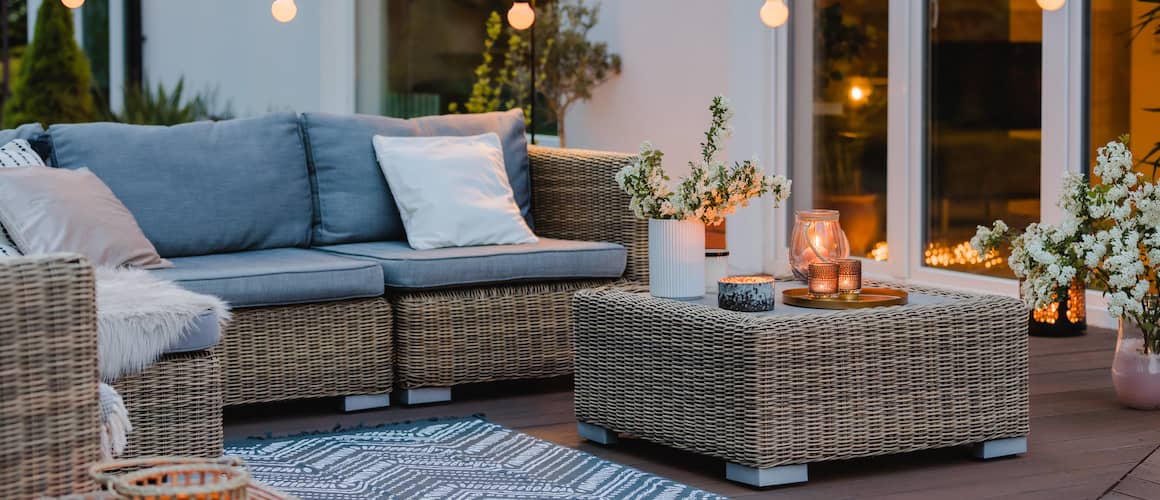 Image of calming outdoor patio grey furniture and design.