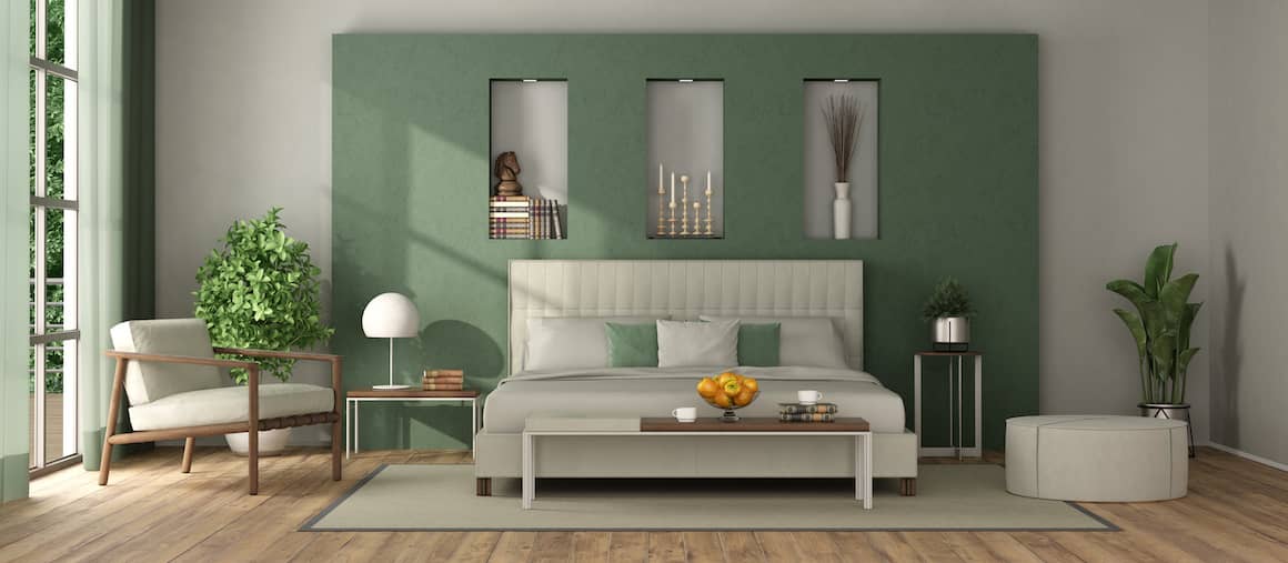 Image of bright, master bedroom design with white bed and green coloring.