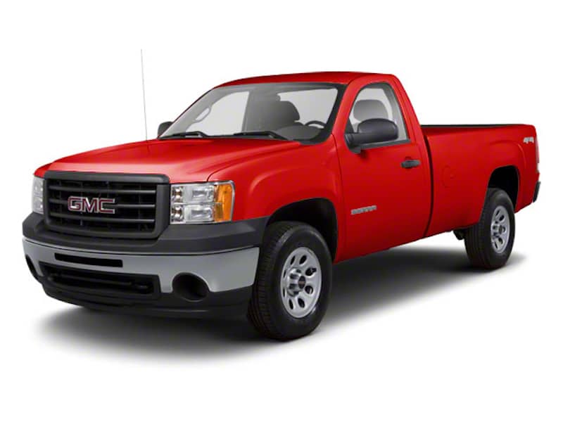 Bright red GMC Sierra truck front exterior view.