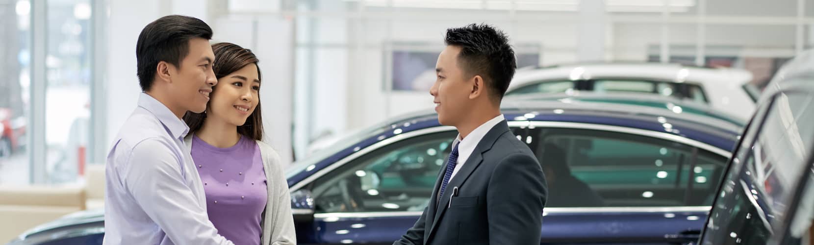 Asian Couple With Salesman