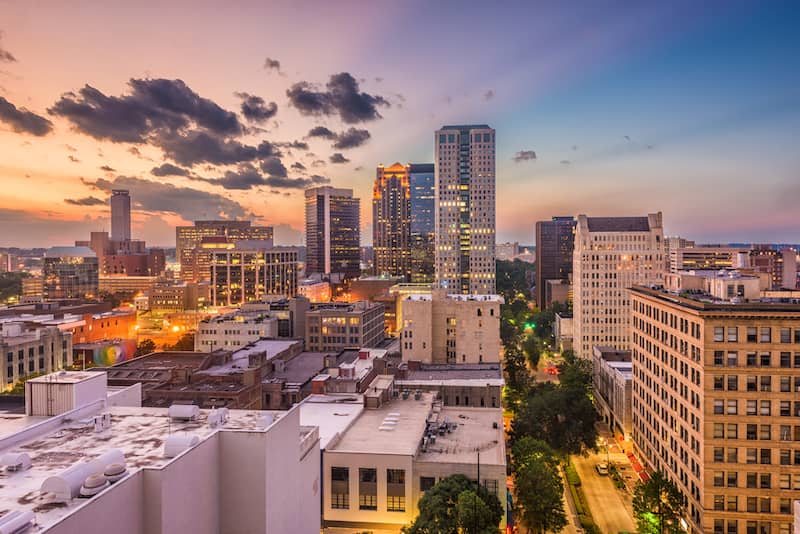 Birmingham, Alabama cityscape with a bright orange sky.