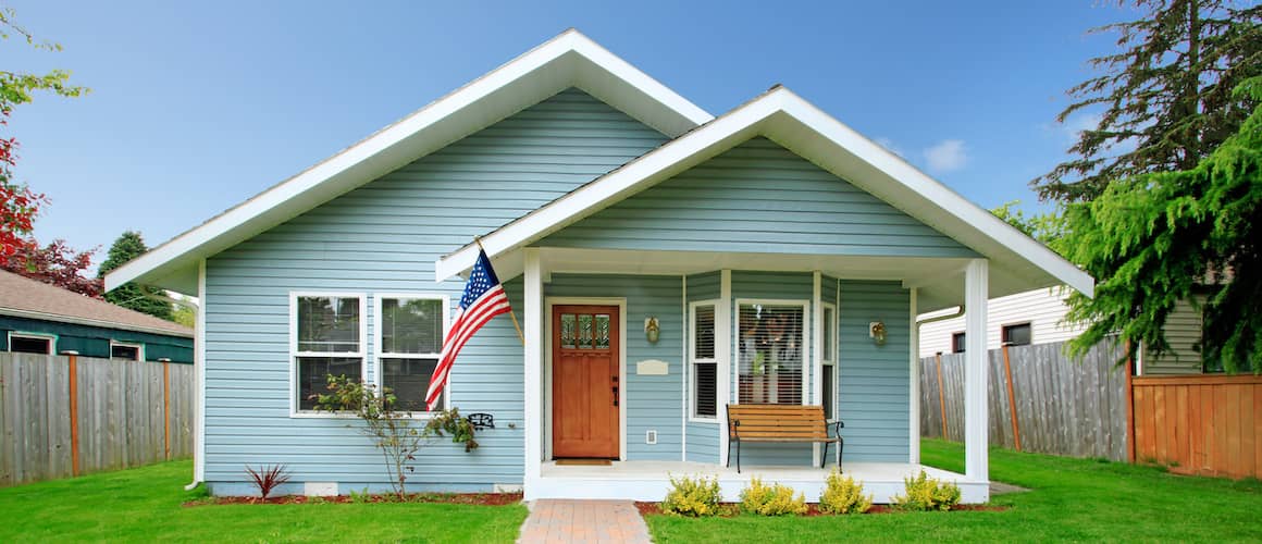 Classic American home with lawn and flag.