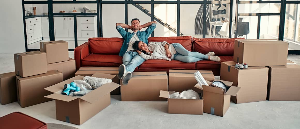Young couple taking a break from unpacking.