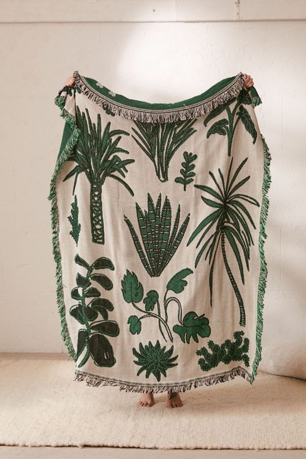 Leaf-patterned throw blanket.