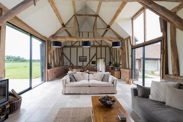 Open barn living room with large windows.