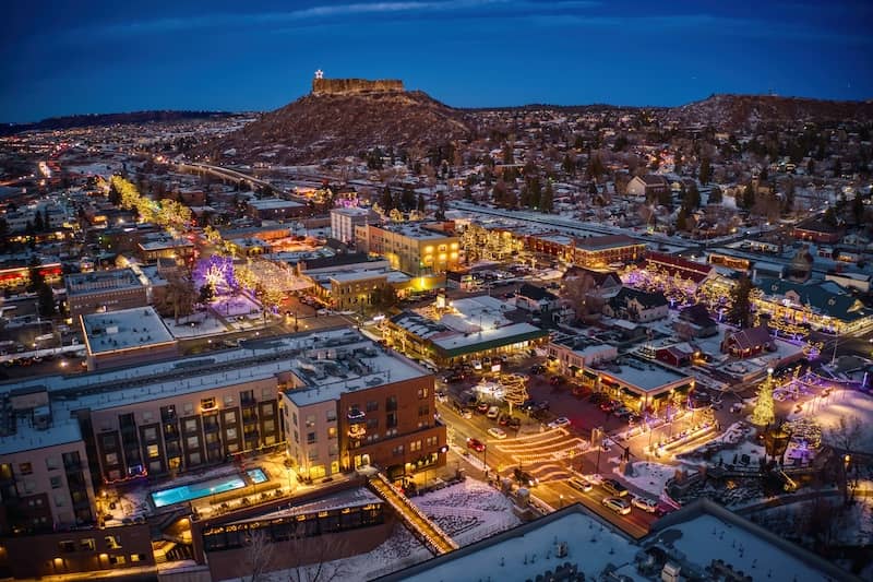 Night time aerial shot of Castle Rock, Colorado.
