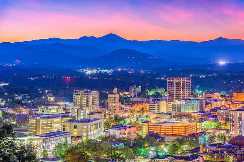 Asheville, North Carolina Skyline at dusk with mountains in back