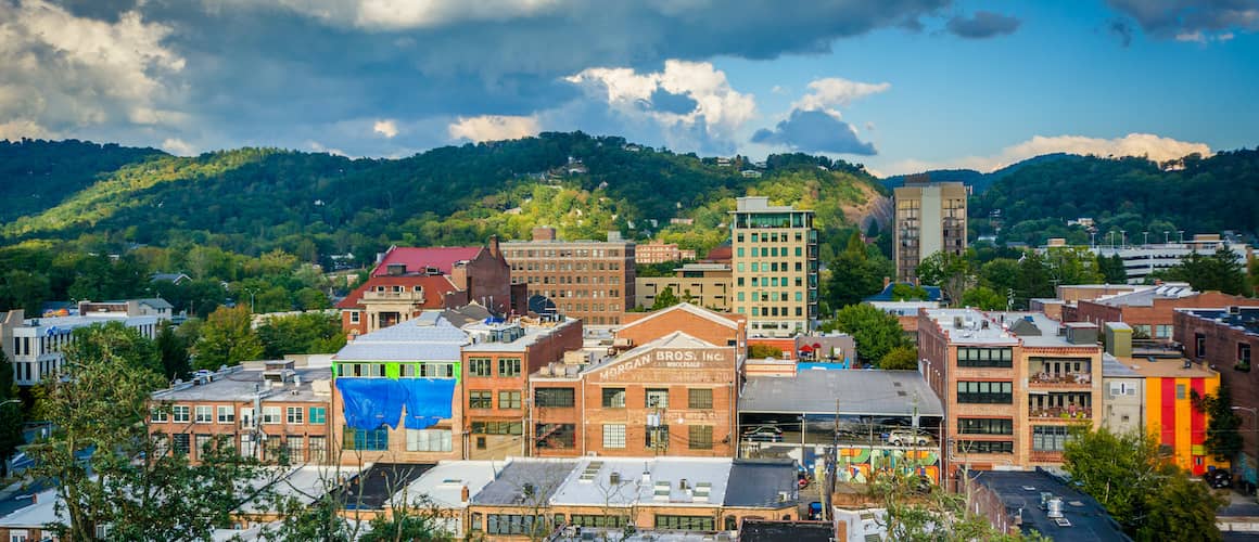 Asheville, North Carolina city view with mountain backdrop