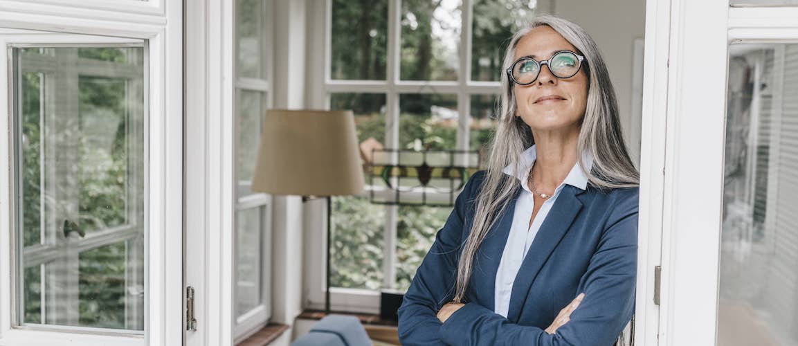 Mature Real Estate Agent Inside All Season Room