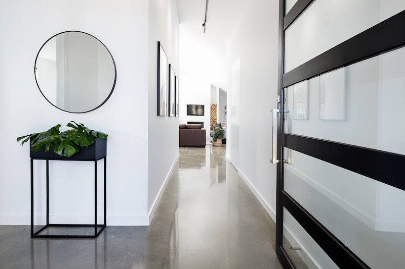 Modern entryway with concrete floors.