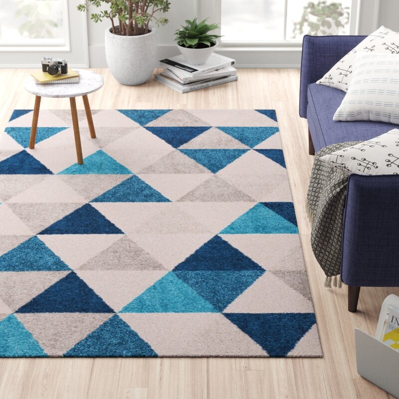 Geometric rug with multiple shades of blue and grey