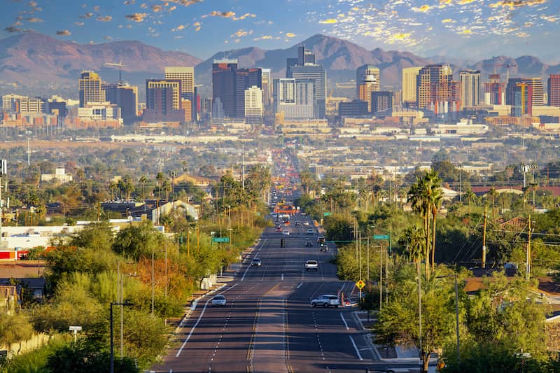 Road leading to Phoenix, Arizona surrounded by mountains, most sustainable cities in the US, most eco-friendly cities, Greenest cities in the US