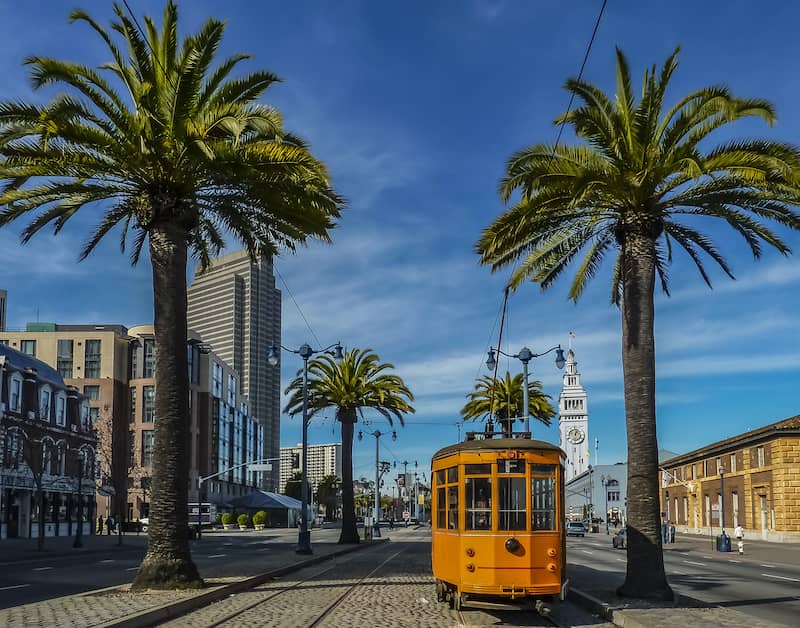 Railcar between palm trees in San Francisco
