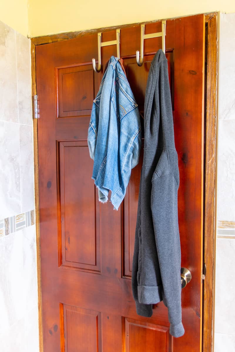 Over the door hooks that allow for extra back of door storage with hanging coats.
