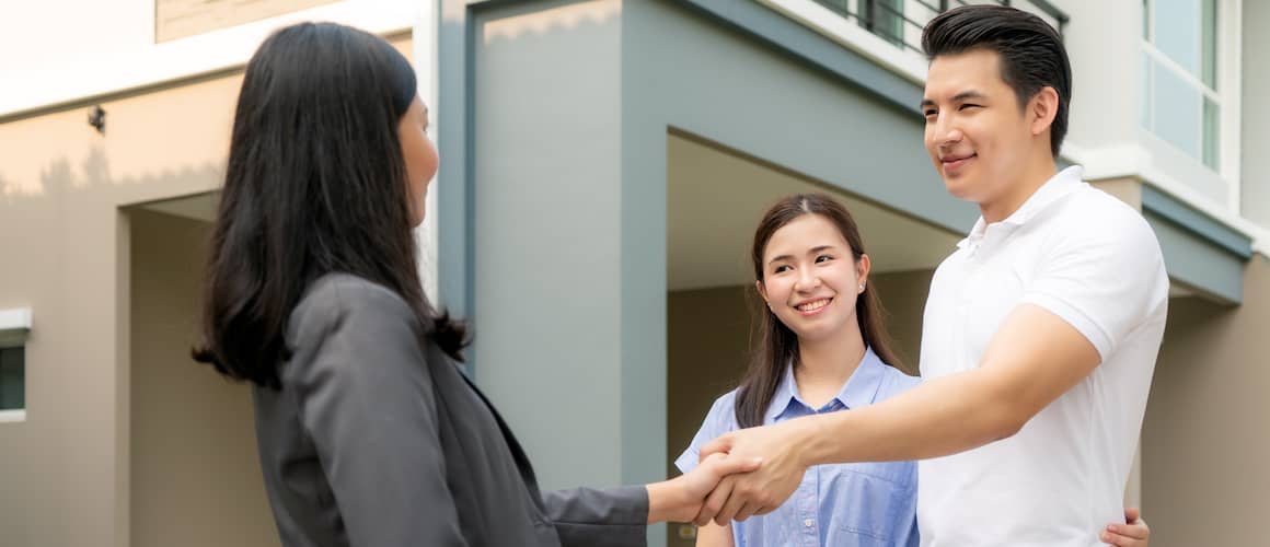 Asian Couple Shaking On New House With Female Agent