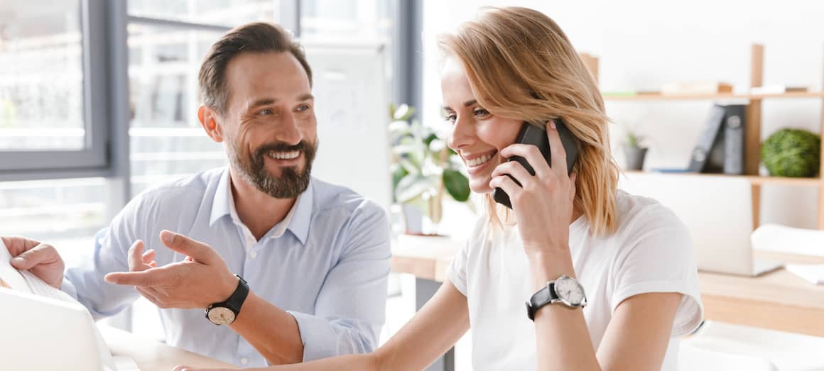 couple on phone call speaking to agent