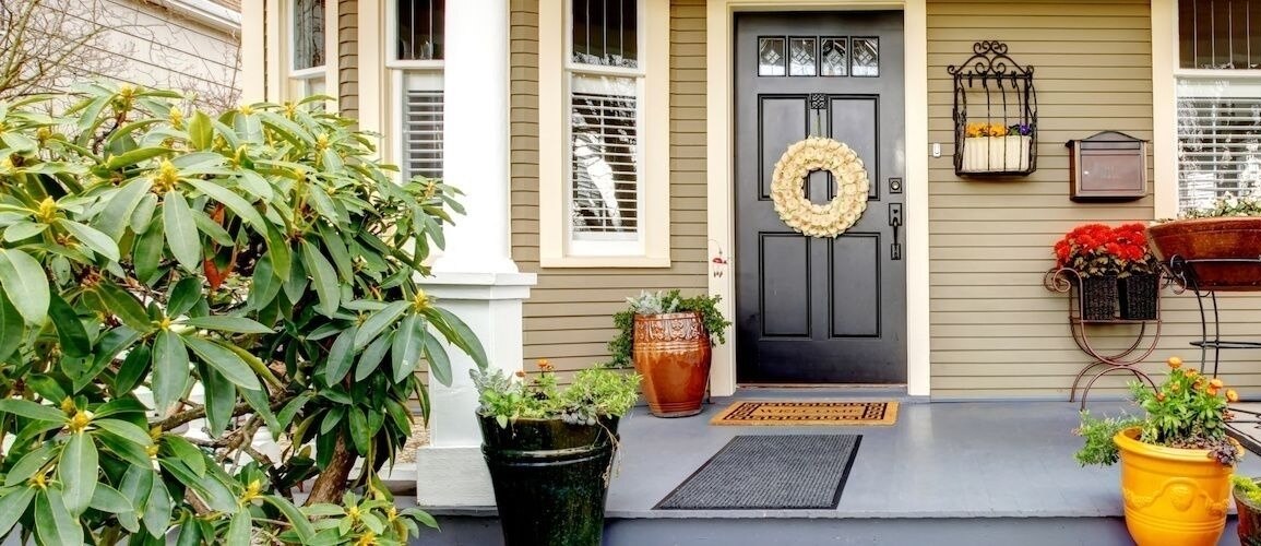 Front porch with lots of planters.