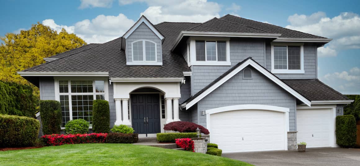 gray two story house with nice landscaping