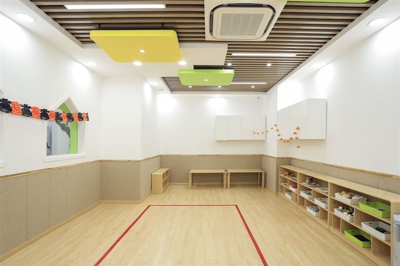 Empty and colorful playroom for kids in basement.