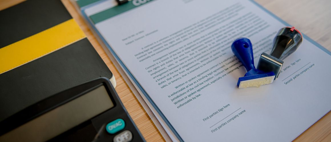 property deed beside calculator