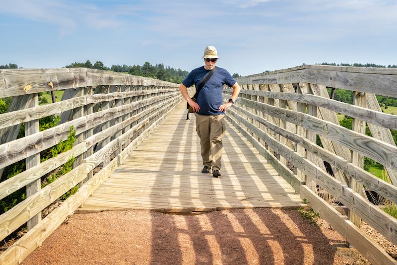 Retiree walking on a bridge in northern Nebraska