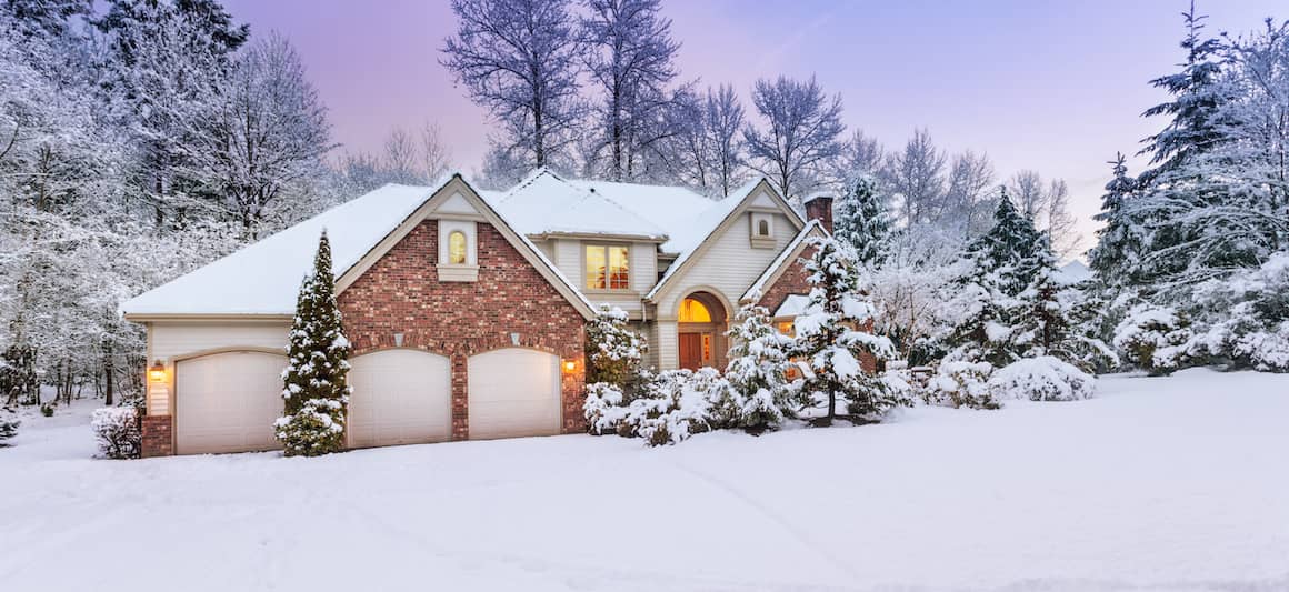 snowy home at dusk