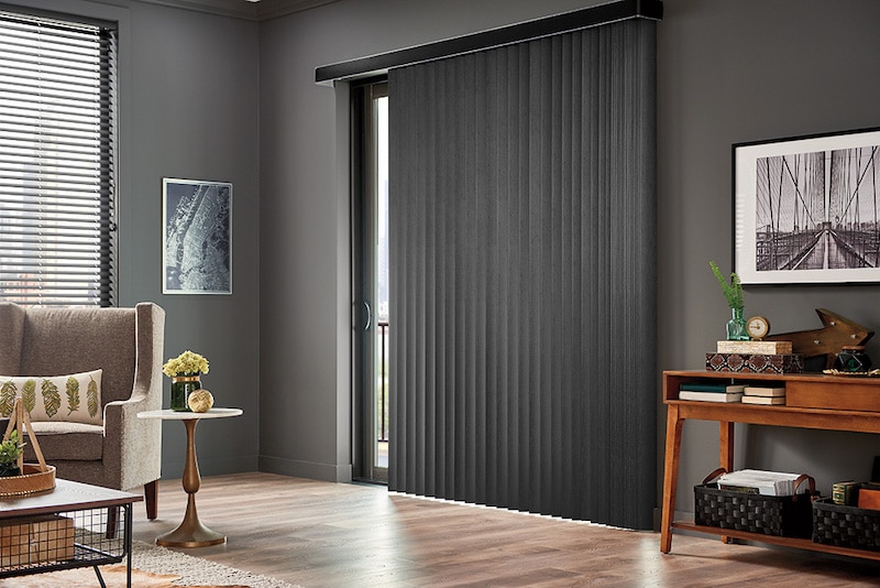 Vertical blinds over a sliding door.
