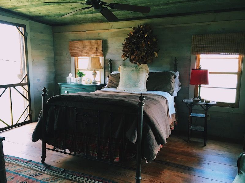 Bedroom with wallpaper on the ceiling.