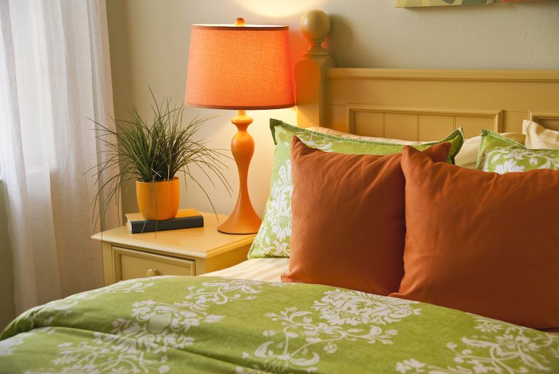 Bright colored room with orange and green.