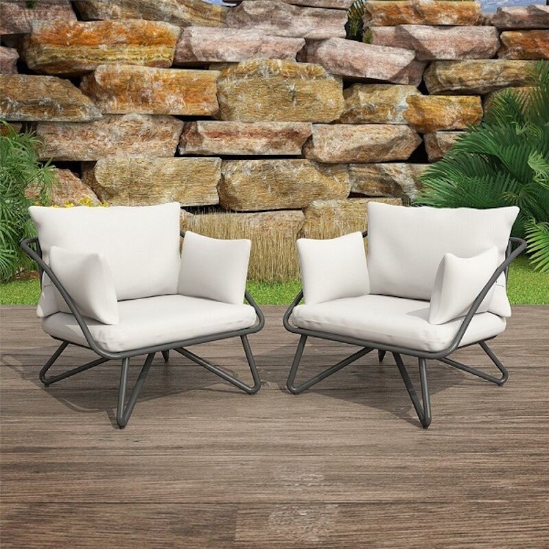 midcentury style lounge chairs with beige cuchions
