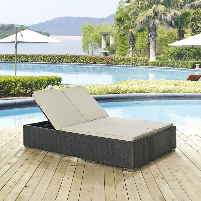 outdoor chaise chair on a deck by a pool