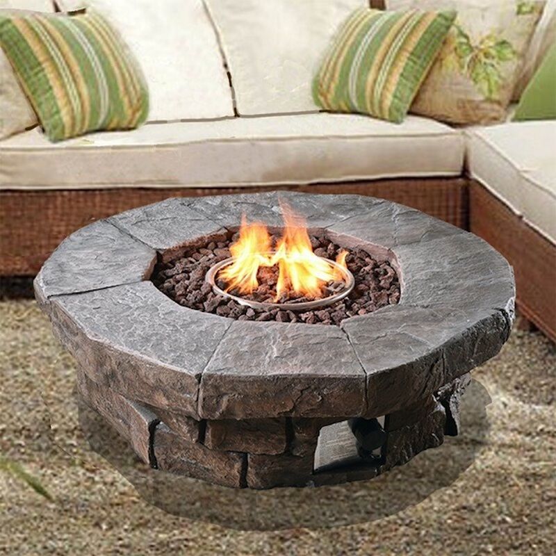 fire pit with outdoor furniture around on a pool deck