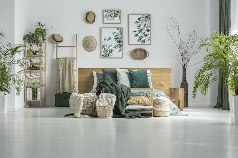 Bedroom decorated with wall art.