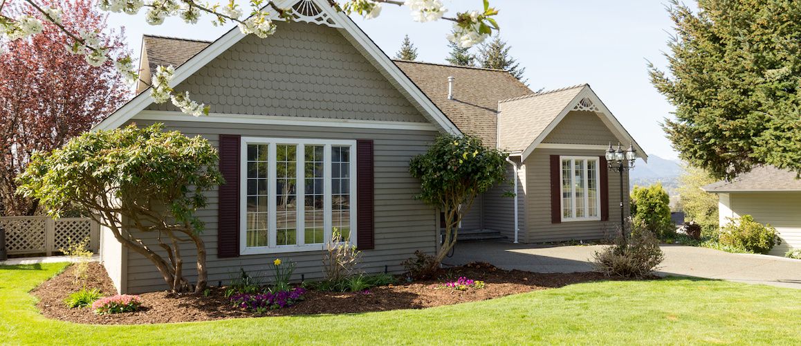 Bungalow with large window in front.