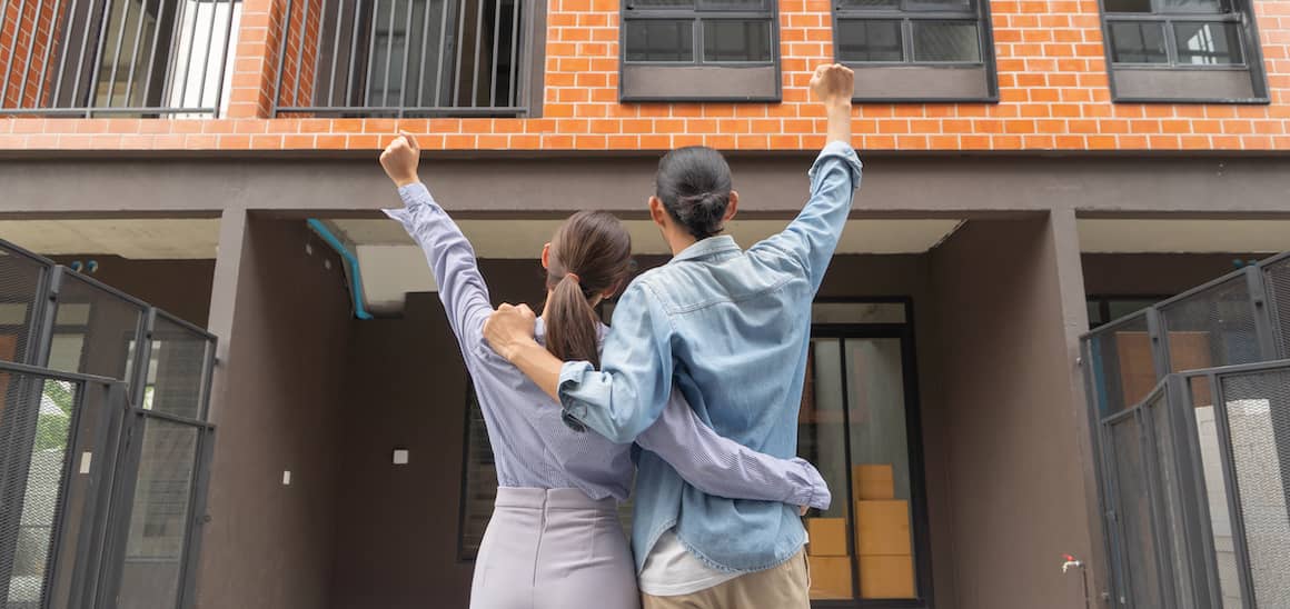 A couple excited to buy a home.