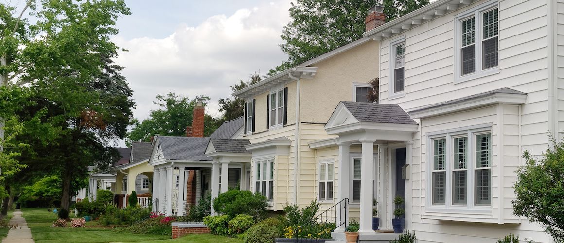 City block with houses and well-kept lawns.