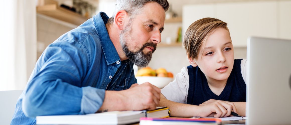 Father and child doing homework.