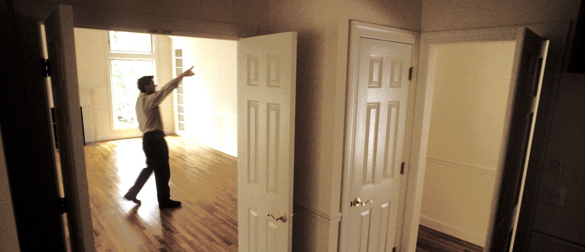 Man inspecting a home.