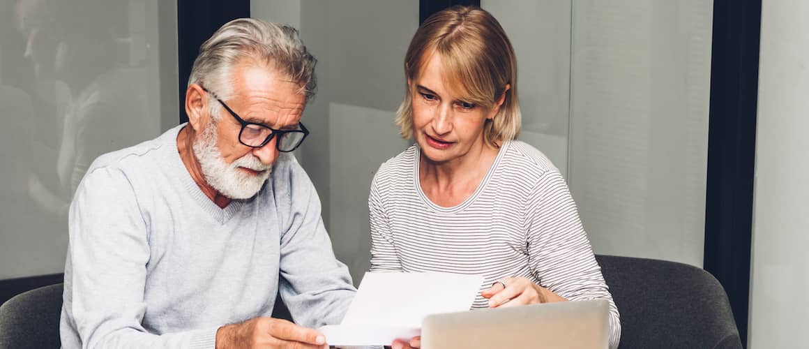 Mature Couple Reviewing Financial Statements