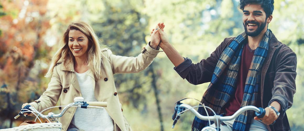 Couple On No Spend Challenge Biking Together