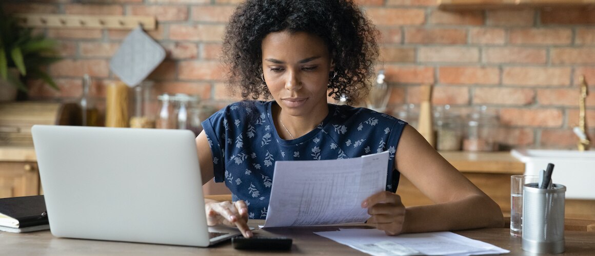 woman on laptop working on finances
