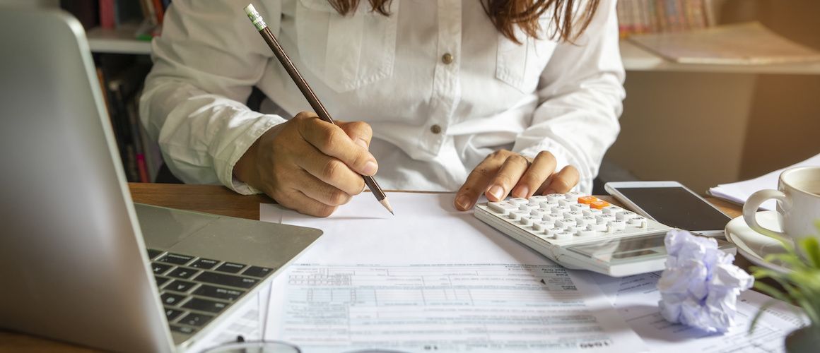 Woman working to file her taxes.